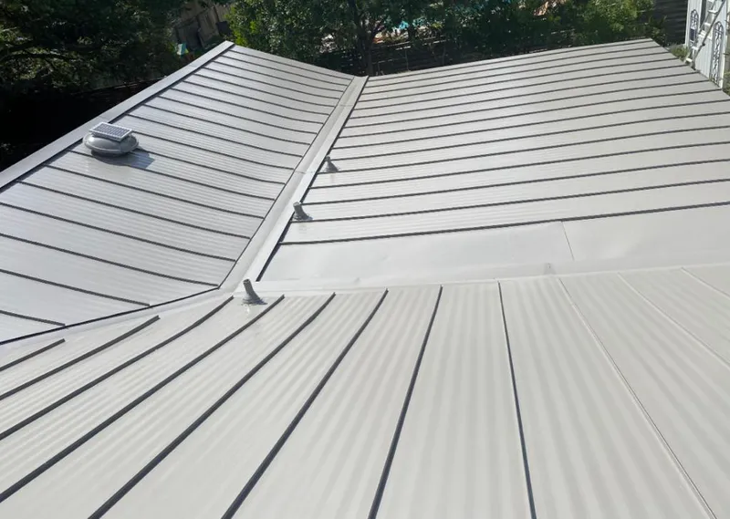 Solar attic fan installed on a metal roof for Roof Ventilation in Merrillville